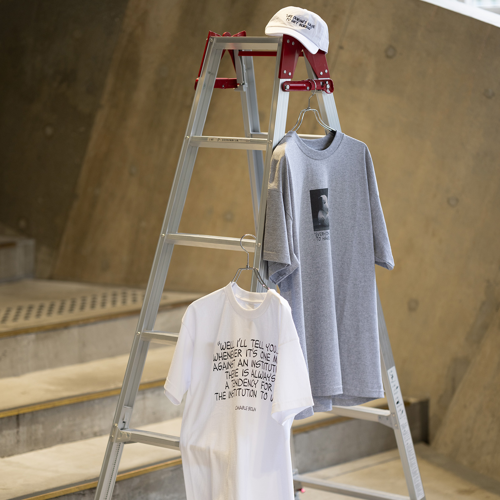 A photo of “LIFE DOESN‘T HAVE TO GET BORING Cap.”, “EVERYONE NEEDS TO HAVE HOPE Tee.” and “WHENEVER IT'S ONE MAN AGAINST AN INSTITUTION Tee.”