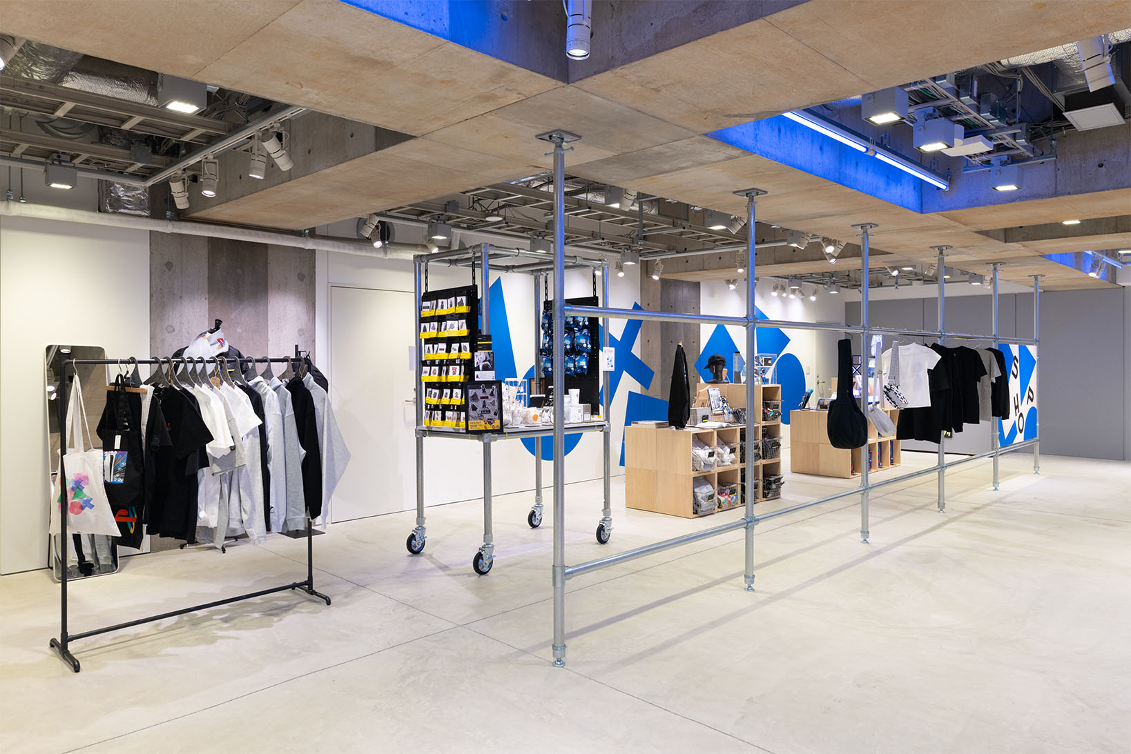 Photo of the B2 PlayStation merchandise shop, offering a variety of products ranging from apparel to stickers.