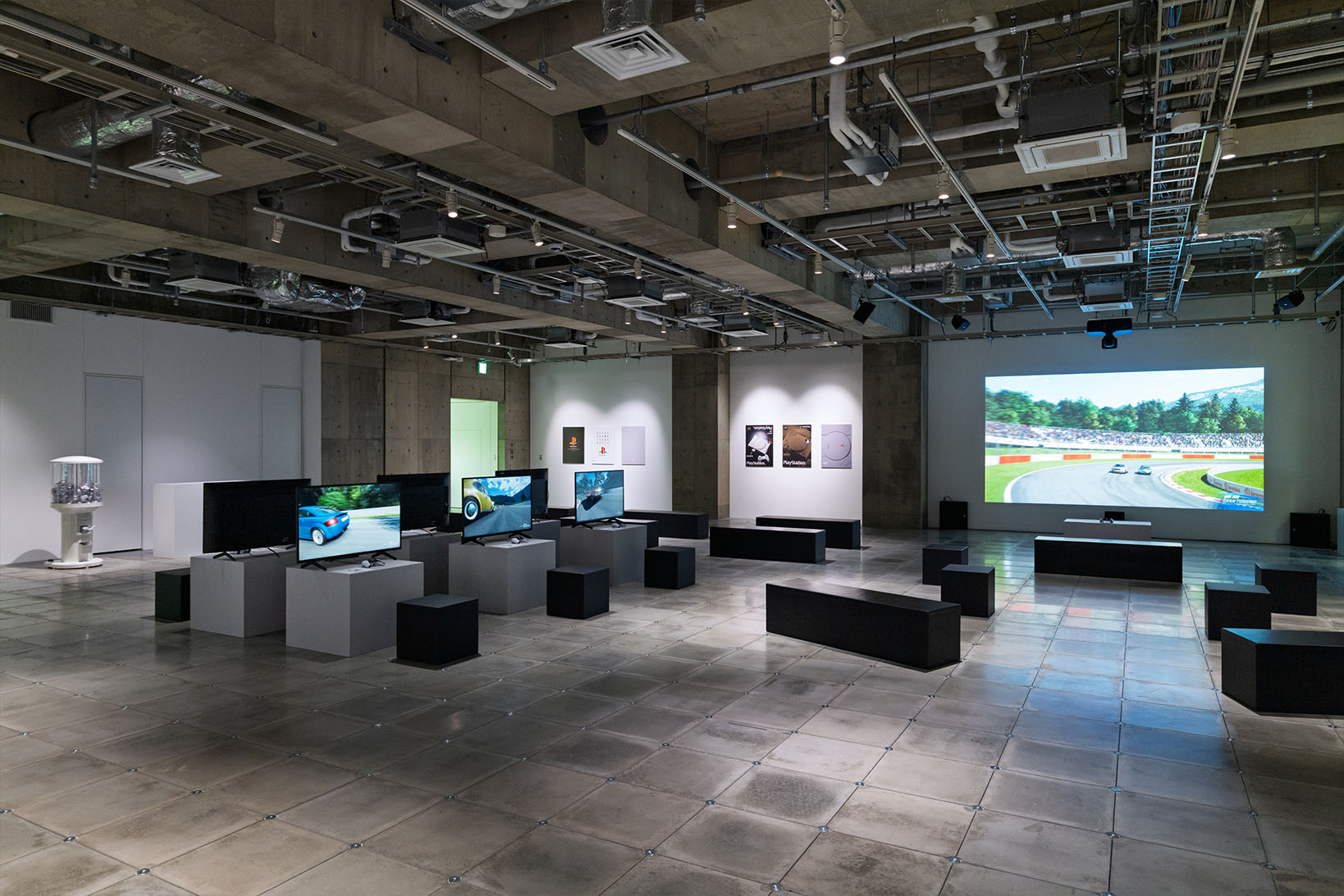 Photo of the 3F area, showcasing the space where 'My First Gran Turismo' can be experienced and the display of posters.