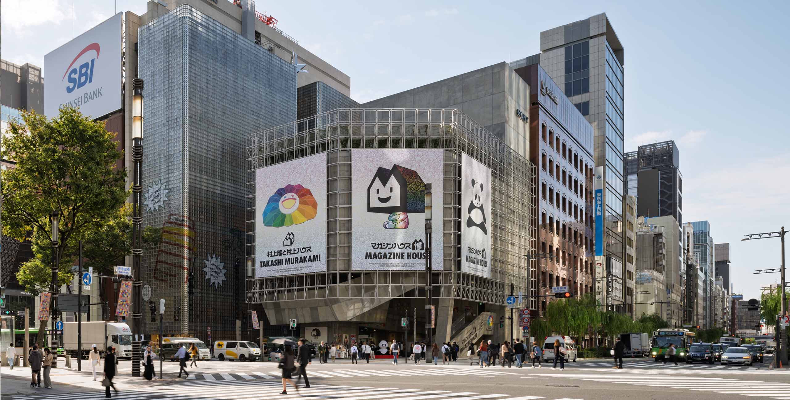 The exterior of Ginza Sony Park facing the Sukiyabashi Crossing in Ginza. A large banner reading 'Magazine House Exhibition: From Ginza to the World' is displayed on a grid frame.